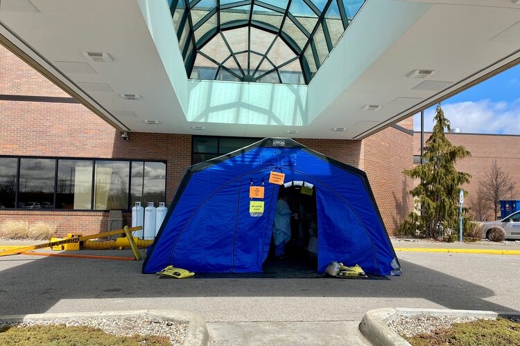 Health officials ask people to call before coming to the hospital or physician offices with COVID-19 symptoms. At McLaren Bay Region, patients are screened inside a tent outside the hospital in order to reduce the risk to employees or other patients.