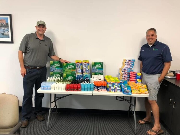 Rob Clark and Matt Felan with the donations provided by Michigan Sugar Company.