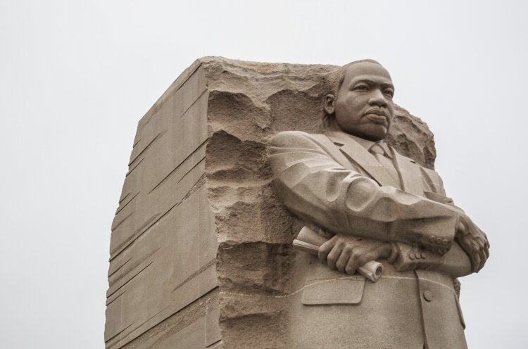 A stone statue in Washington DC commemorates the work of Dr. Martin Luther King Jr.