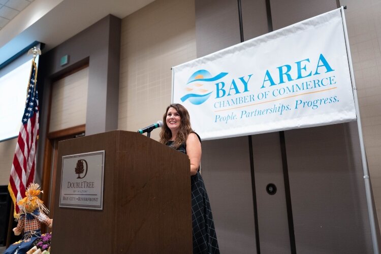 Chamber CEO Magen Samyn greets guests at the Eye Opener Breakfast.