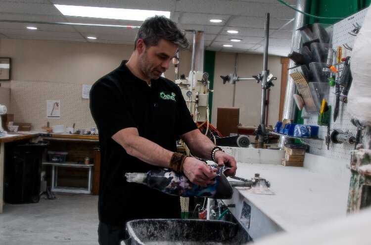 Nicholas Harrier unleashes his creativity at his job as a patient advocate and lab technician for Oakland Orthopedic Appliances. He has earned an international reputation for his custom covers for prosthetic devices.