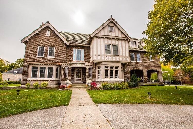 The Perry House at 2230 Center Ave. may be the largest home in Bay City. This Tudor Revival style home features stucco-and-board faces, half-time framing, and steeply pitched roofs. 