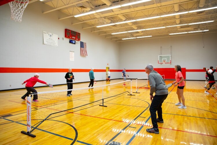 Pickleball is about social interaction and fitness as much as it is about competitiveness. On a recent weekday, players filled the Bay County Community Center. From left, Sue Anderson, Ashley Anderson, Barb Thayer, and Vern Botts.