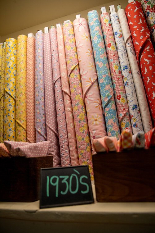 Reproduction fabrics from as far back as the Civil War and the 1930s fill half the shop. Modern fabrics fill the other half.