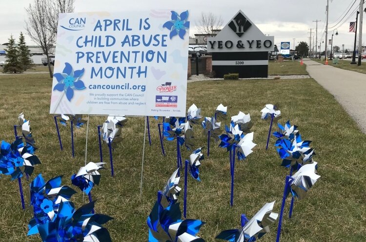 Blue and silver pinwheels at area businesses serve as a reminder that April is Child Abuse Prevention Month. (Photo courtesy of the CAN Council) 