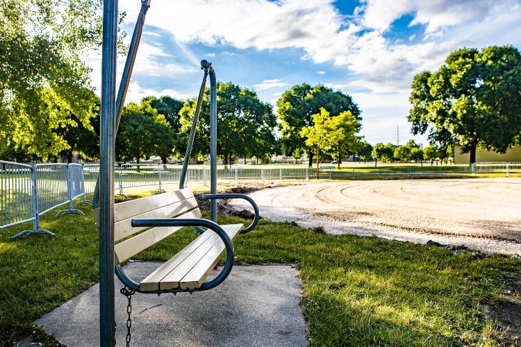 Bench swings still sit near Play City, giving parents and others a place to rest and watch the kids have fun.