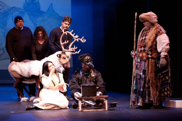 Three people work together to operate the reindeer puppet appearing onstage at the Bay City Players this weekend.