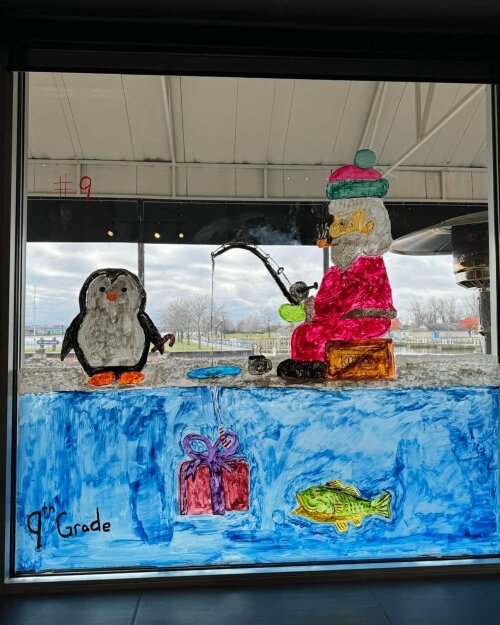 Santa Claus takes a break to catch a fish in the Saginaw River in this window at H2O's. (Photo courtesy of H2O's Waterside Grill)