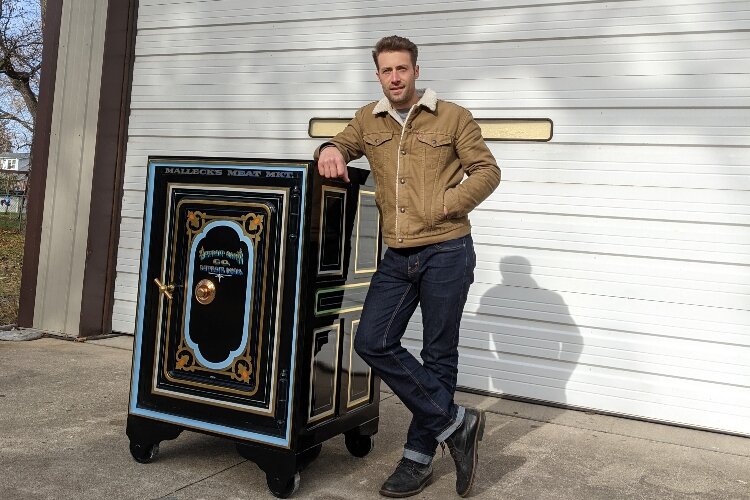 Justin Stilson's hand painted this safe from the 1870s, restoring its beauty.