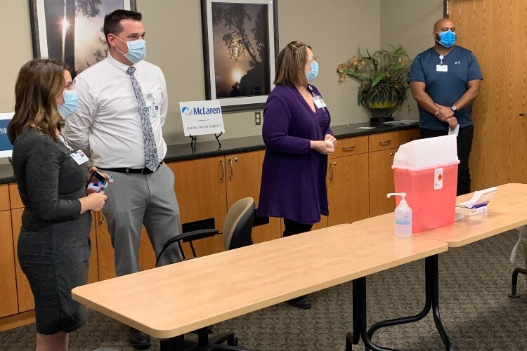 From left, hospital spokeswoman Magen Samyn, Director of Pharmacy David Haugh, RN Lori Skrzysinski, and Dr. Rajesh Dandamudi discuss the new COVID-19 vaccine.