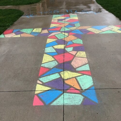 Violet and Larissa Thurlow created this colorful Easter message to greet walkers in a Bay City neighborhood. 