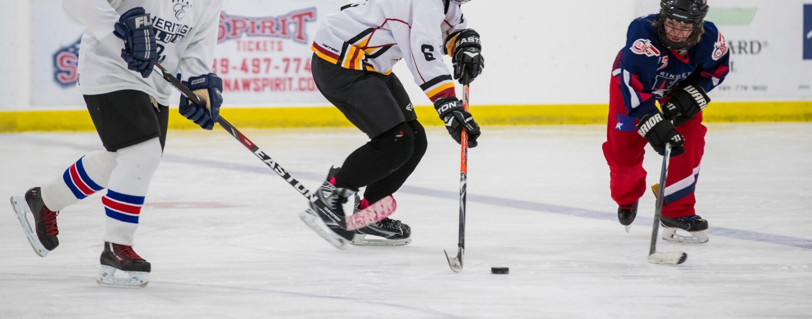 Women skating into a hockey league of their image image