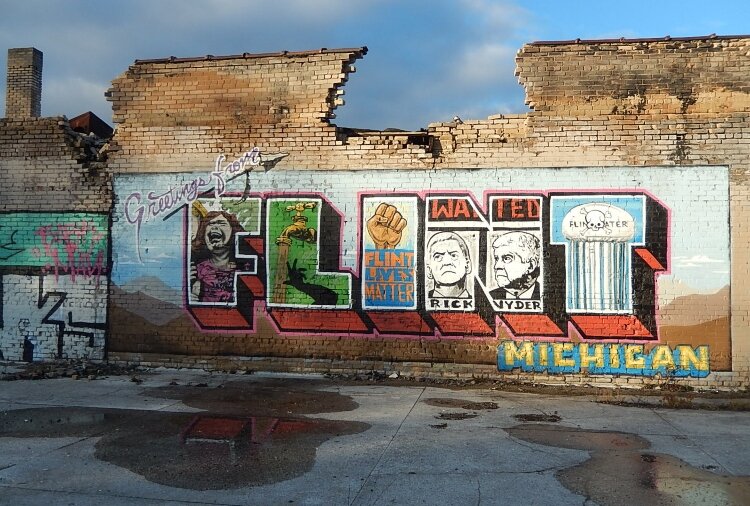 The North Saginaw Street mural in Flint tells pieces of the community's history. The WPA project will dive into many of the topics depicted here. (Photo courtesy of Mary Jo Kietzman)