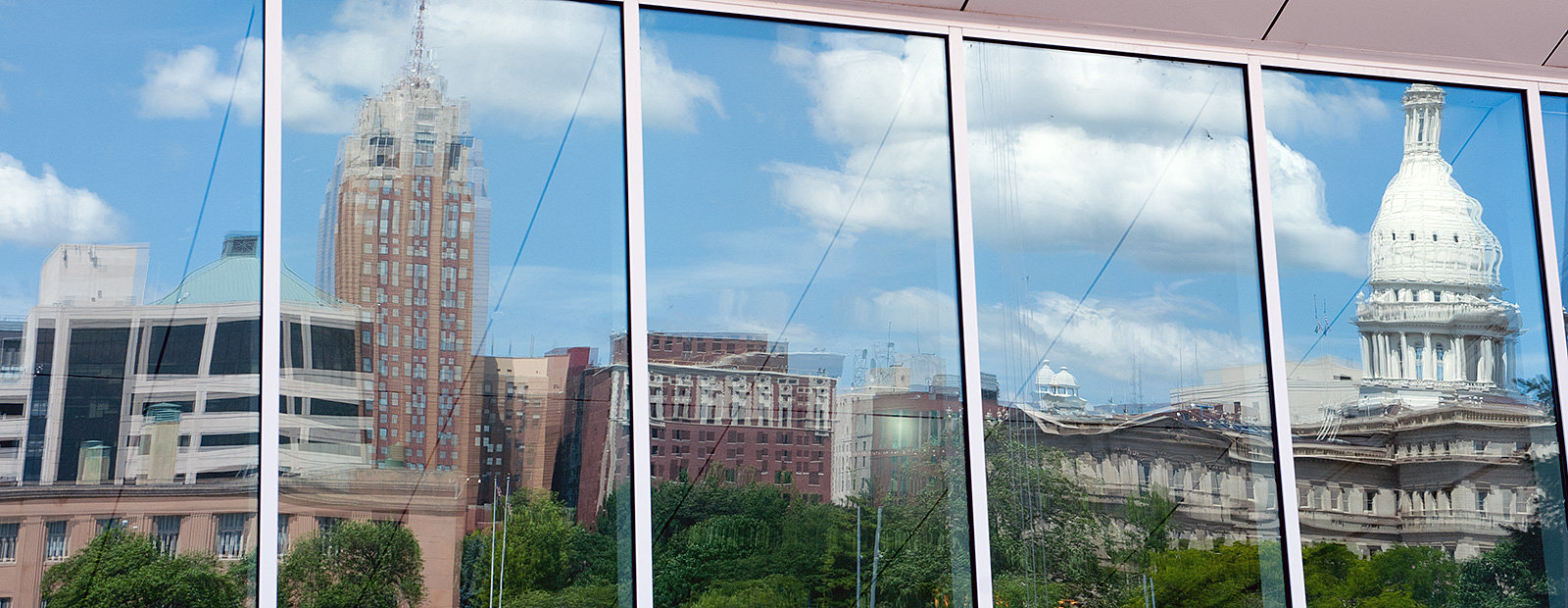 The Lansing skyline reflected in the glass of Constitution Hall - Photo Dave Trumpie