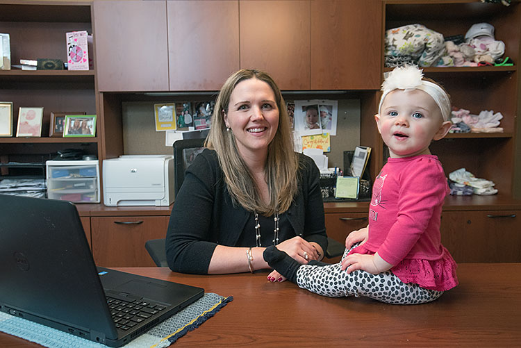 Katie Lynwood  in her home office with daughter Genevieve - Photo Dave Trumpie