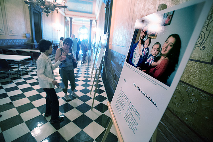 Visitors view work during the Capitol opening of the show