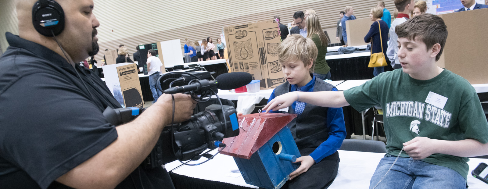 Student explaining their business plans at LEAP's youth entrepreneur program - Photo Dave Trumpie