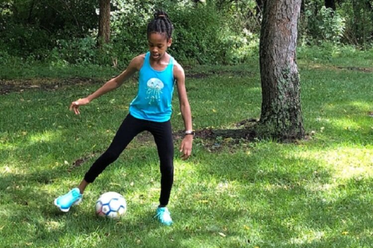 Rachel Korley practices soccer.