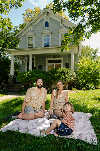 Rachel and Tarek Kanaan with their son River outside their Oak Street home