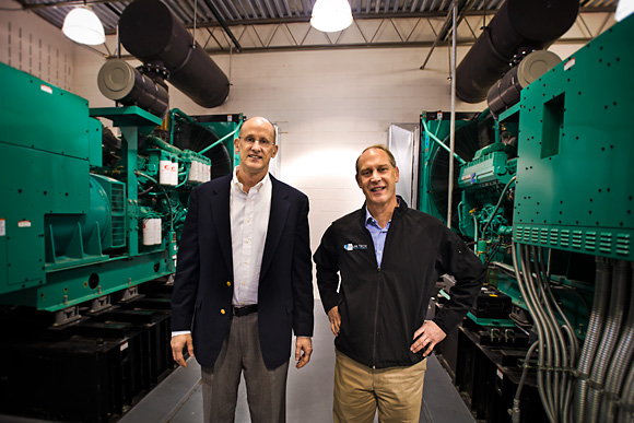 L to R Mike Klein and Yan Ness with the twin power generators at Online Tech in Ann Arbor