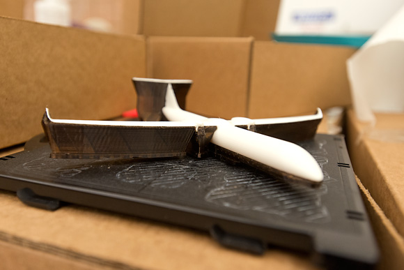 An airplane printed on the FDM Machine with support material added in the printing process
