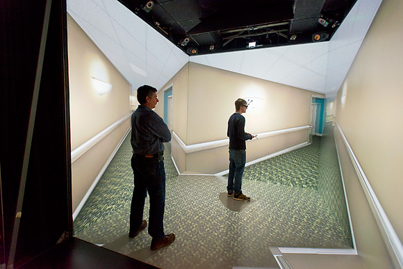 Ted Hall (left) demonstrates MIDEN for a student