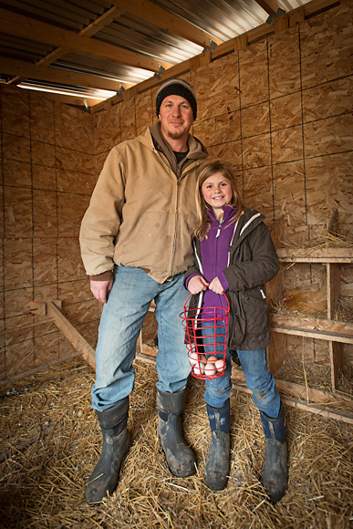 Jason Gold and his daughter gathering eggs at the Michigan Folk School