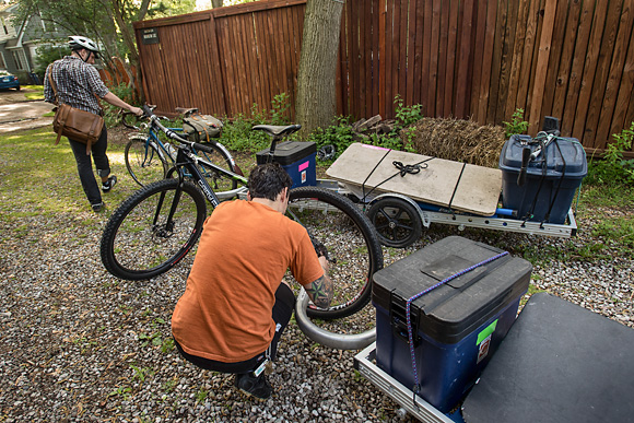 Ben Schultz and Jimmy Ragget hook up their bike trailers