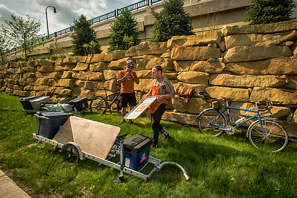 Jimmy Raggett and Ben schultz packing up Common Cycle's mobile repair tent