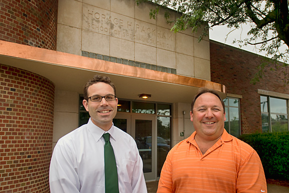 L to R Jay Peterson and Bob Densic with the new copper flashing at Rackham Hall