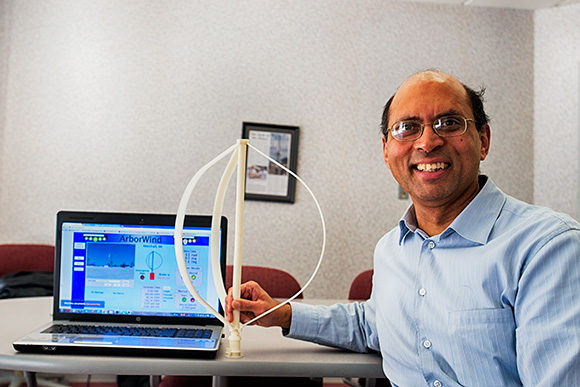 Dilip Nigam of Arborwind with a model of his wind turbine