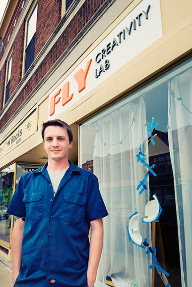 Rob Todd with his sign at Fly Creativity Lab Ypsilanti