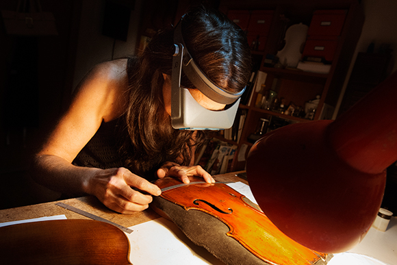 Sharon Que in her violin restoration shop