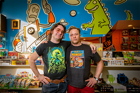 Jeremy Wheeler and the Vault of Midnight's Curtis Sullivan in front of Jeremy's wall mural