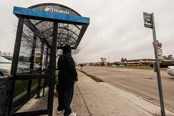 Waiting for the AATA bus on Washtenaw Avenue in Ypsilanti