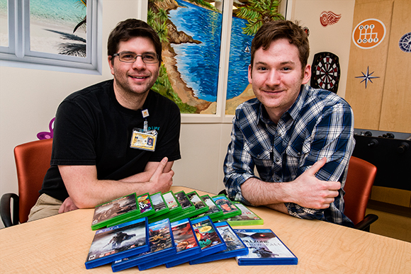 L to R Jean-Jacques Bouchard and Child Life Specialist Zach Wigal in the teen activity center at CS Mott Children's Hospital  