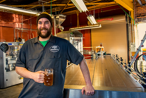 Arbor Brewing Company Microbrewery brewery manager Dan Peron on the bottling line
