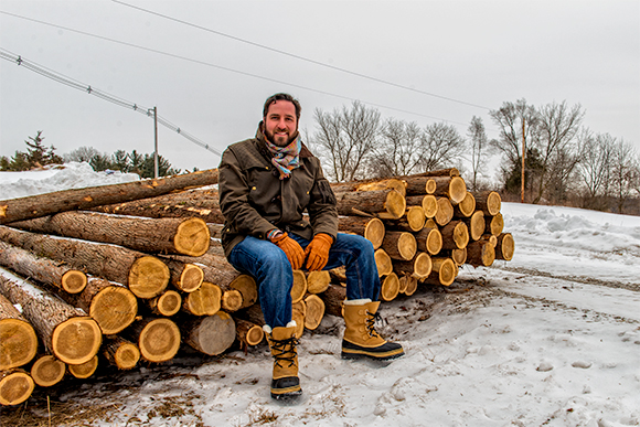 Louis Breskman with poles for hop trellises at Groovy Hopster Farm in Chelsea  