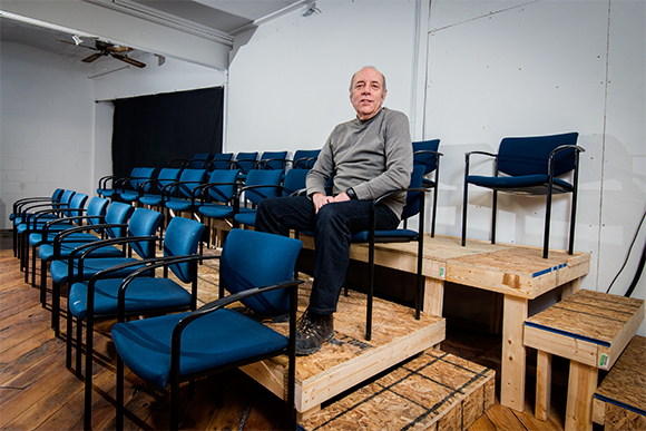 Karl Diez with the new seating section at The Yellow Barn