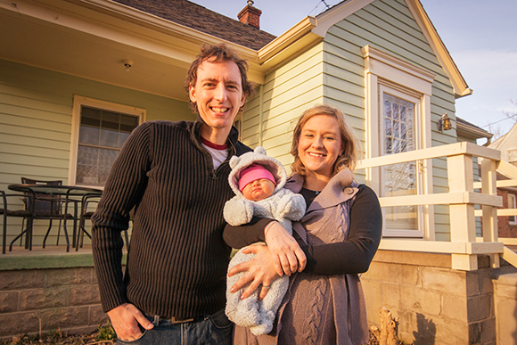 Author Natalie Burg with husband Mike Vial and baby Ginny at their Superior Township home