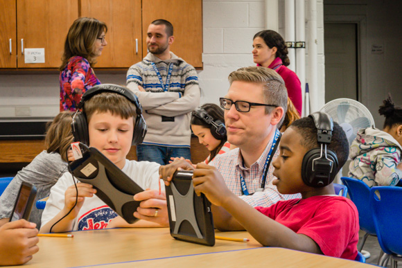 Teacher Bill Van Loo with students at the STEAM Lab