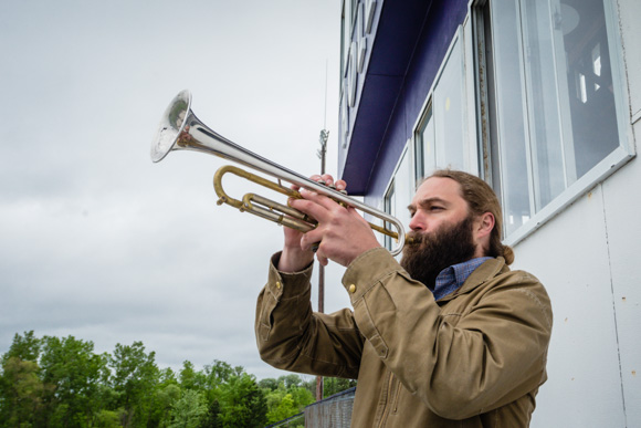 Ross Huff plays the national anthem at Hollway Field