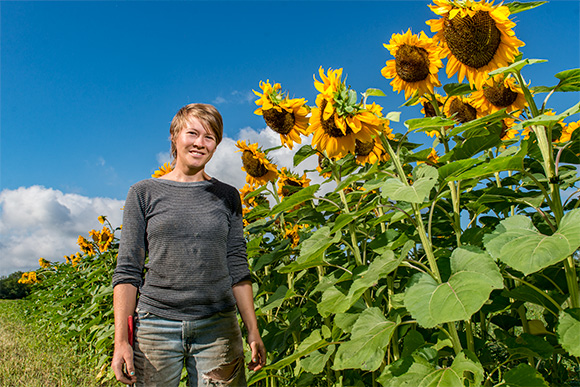 Hannah Rose Weber with her sunflowers at Tilian Farm