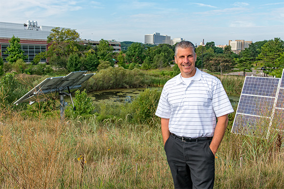 Andrew Berki overlooking a stormwater management pond on North Campus 