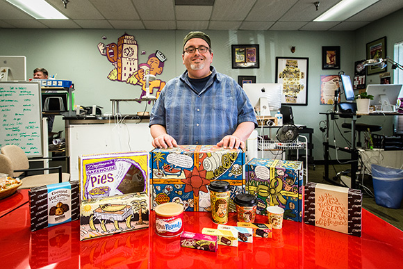 Ian Nagy with many examples of his work for Zingerman's