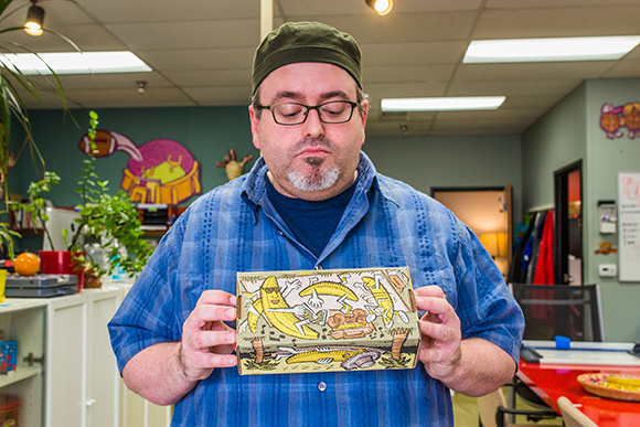 Ian Nagy with the Zingeman's banana bread box he designed