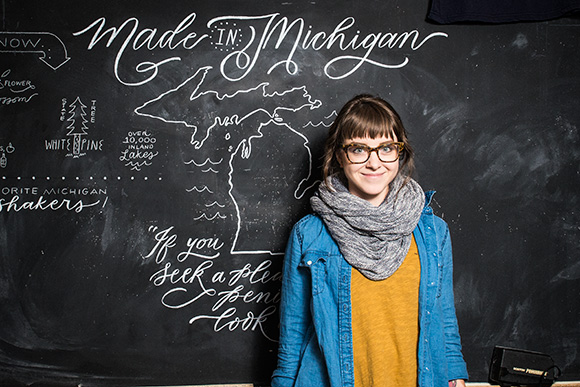 Kristen Drozdowski working on a display at Rock Paper Scissors