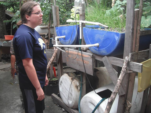 Michelle Leach with the original Oasis Aquaponics system