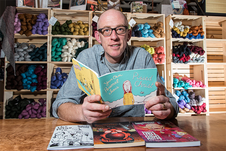 Pete Sickman-Garner with one of his comics