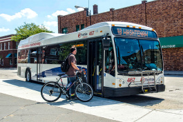 Loading a bike on a bus at the Ypsilanti Transit Center